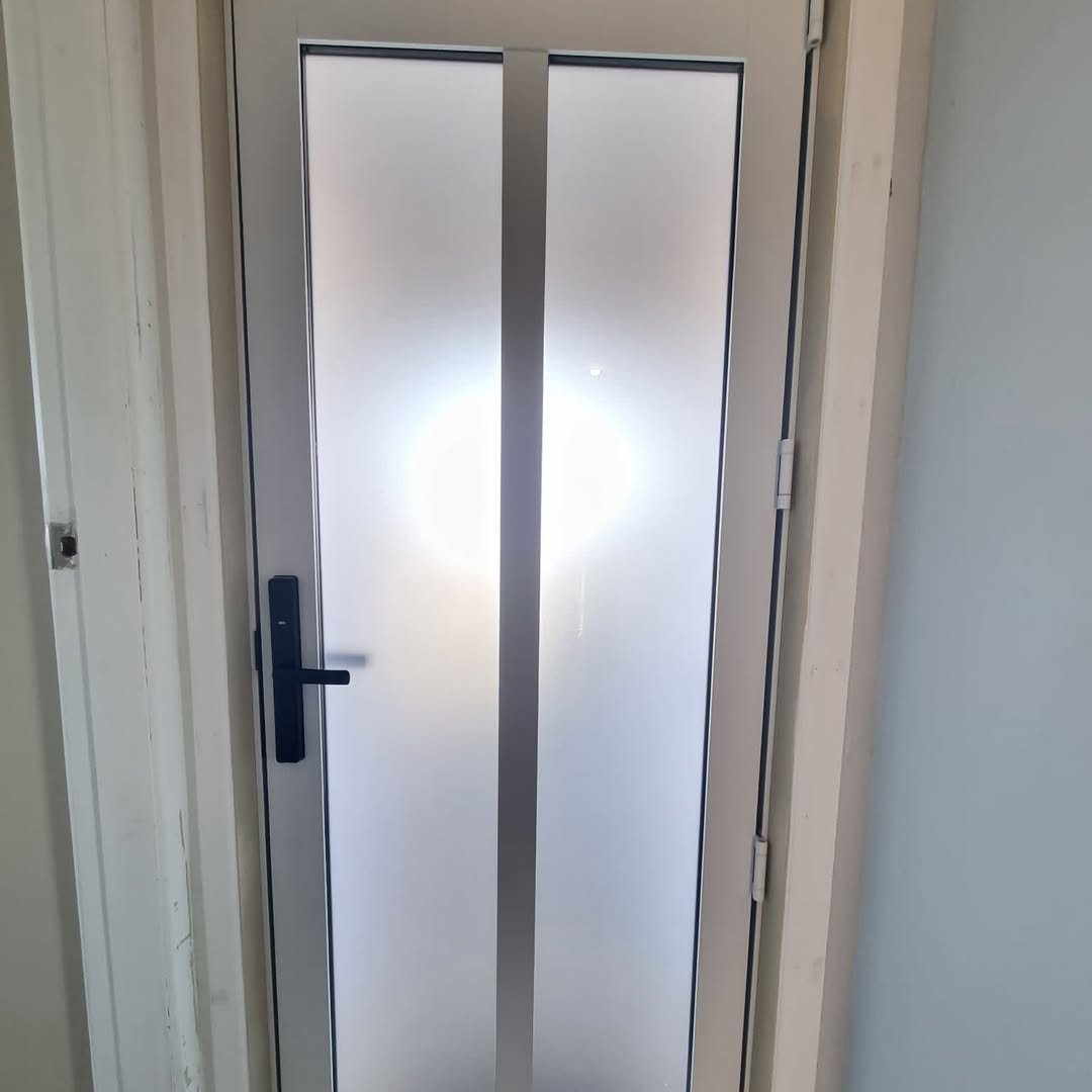 Aluminium entry door with frosted safety glass
